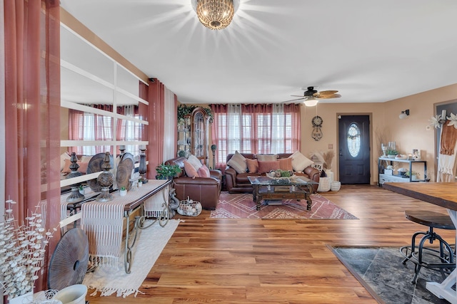 living room featuring hardwood / wood-style flooring and ceiling fan