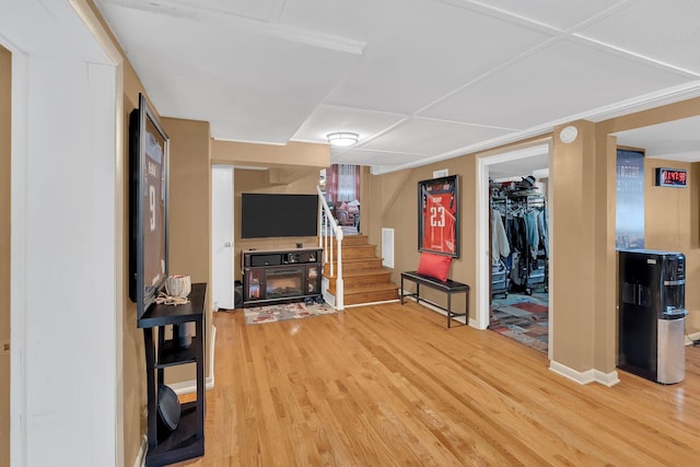 interior space with a multi sided fireplace and hardwood / wood-style floors