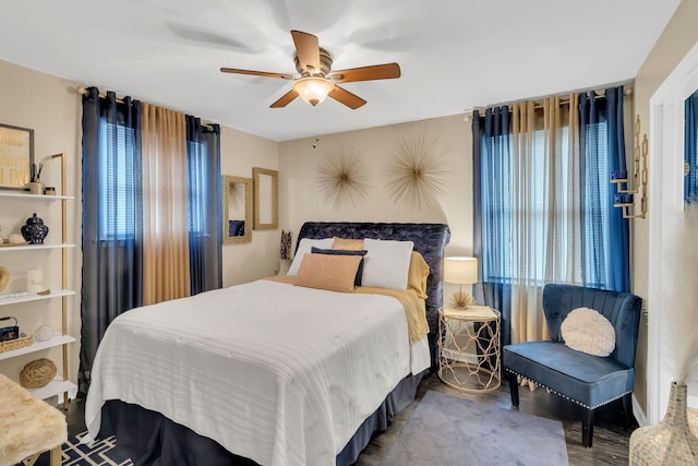 bedroom with wood-type flooring and ceiling fan