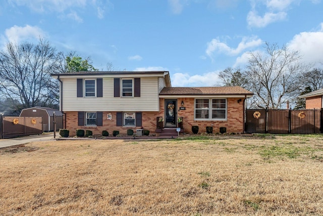 tri-level home with a front yard