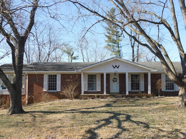 ranch-style home with a front yard