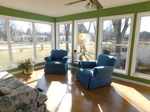 sunroom with ceiling fan