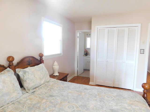 bedroom featuring light hardwood / wood-style flooring and a closet