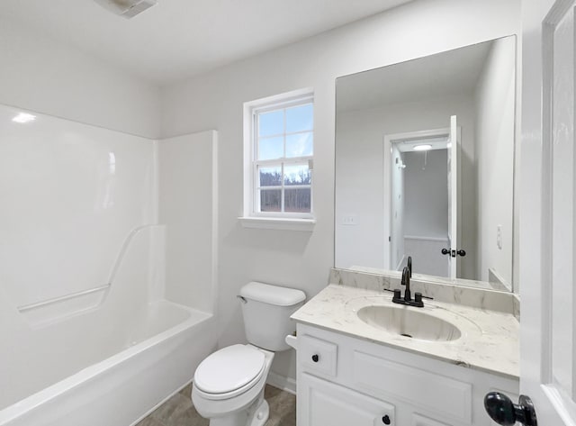 full bathroom featuring vanity, tub / shower combination, and toilet