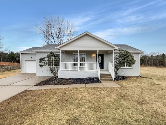 ranch-style home featuring a garage, a porch, and a front lawn