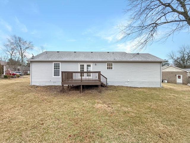 rear view of house with a yard and a deck