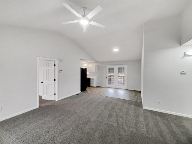 unfurnished living room featuring french doors, ceiling fan, lofted ceiling, and dark colored carpet