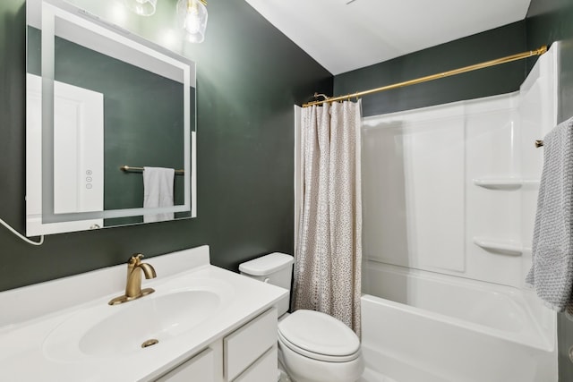 full bathroom with vanity, shower / bath combo, and toilet