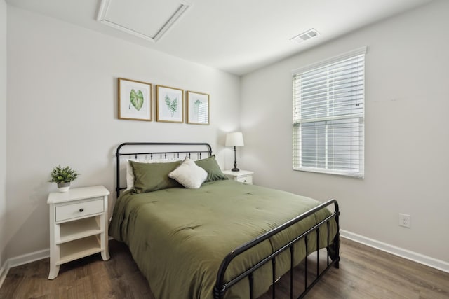 bedroom featuring dark hardwood / wood-style flooring