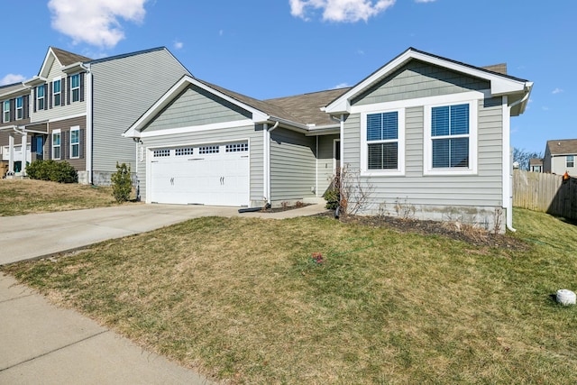 view of front of home with a garage and a front yard