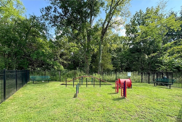 view of community featuring a yard