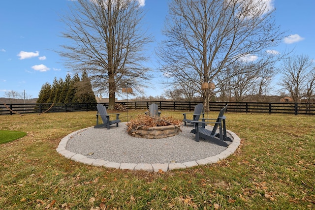 view of yard featuring an outdoor fire pit