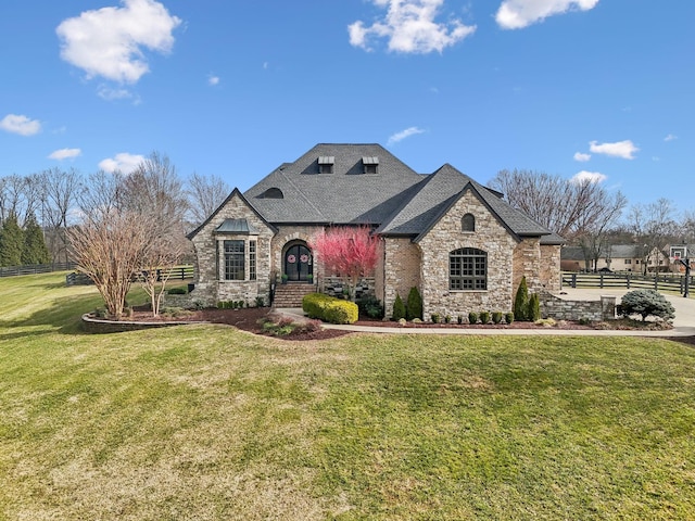 french country home with a front yard