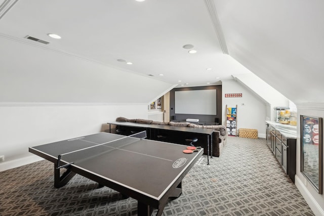 rec room featuring vaulted ceiling, carpet floors, and ornamental molding