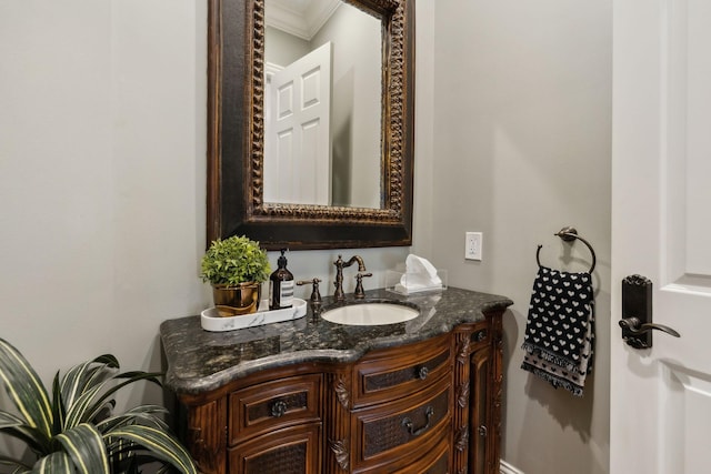 bathroom with vanity and crown molding