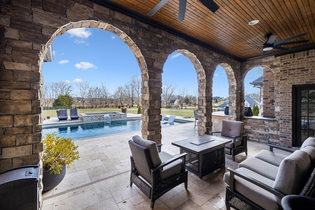 view of patio featuring a swimming pool with hot tub, an outdoor hangout area, and ceiling fan