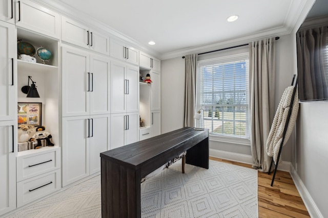 office space featuring crown molding and light wood-type flooring