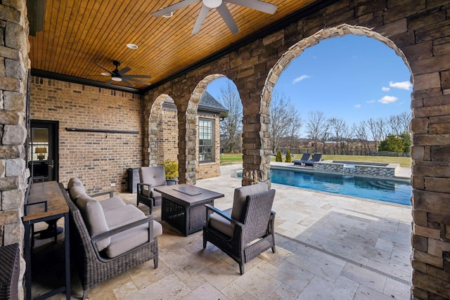 view of patio / terrace featuring a fenced in pool, outdoor lounge area, and ceiling fan