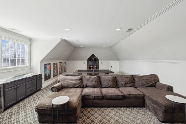 living room featuring light colored carpet, vaulted ceiling, and ornamental molding