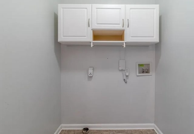 laundry room with hookup for a washing machine and cabinets