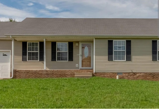 view of front facade featuring a garage and a front yard