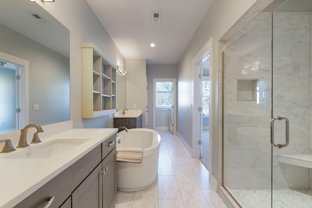 bathroom featuring shower with separate bathtub and vanity