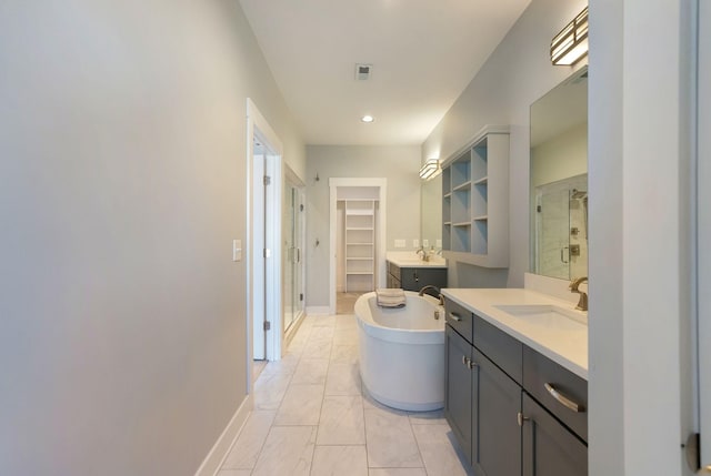 bathroom with shower with separate bathtub and vanity