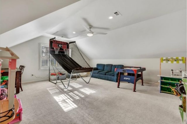 rec room featuring ceiling fan, lofted ceiling, and light carpet