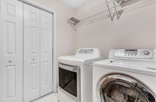 laundry area with separate washer and dryer