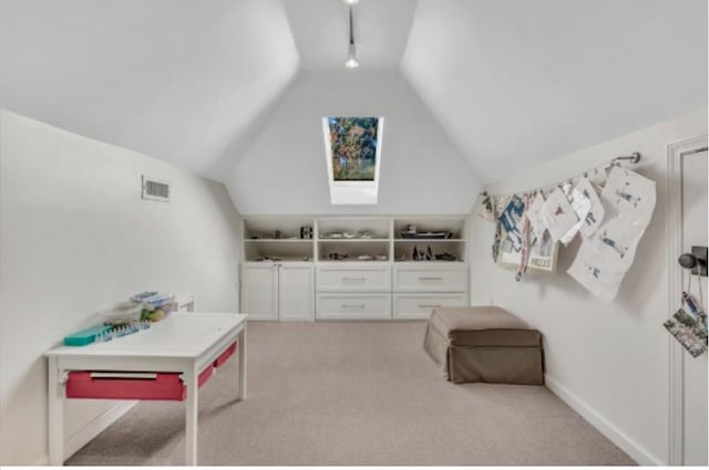 interior space featuring vaulted ceiling and light colored carpet