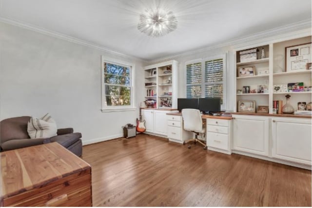 office space with dark wood-type flooring, ornamental molding, and a notable chandelier