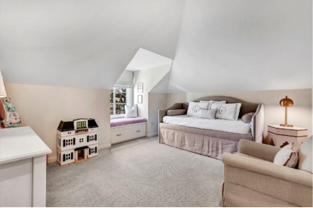 carpeted bedroom with vaulted ceiling