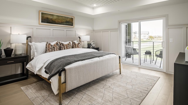 bedroom featuring access to outside and light wood-type flooring