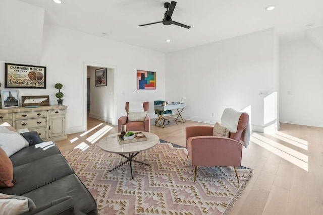 living room featuring ceiling fan and light wood-type flooring