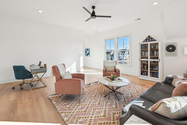 living room featuring ceiling fan and light wood-type flooring