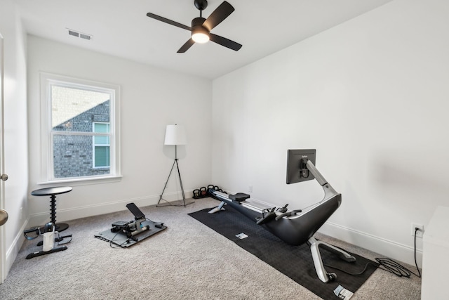 exercise area with carpet flooring and ceiling fan