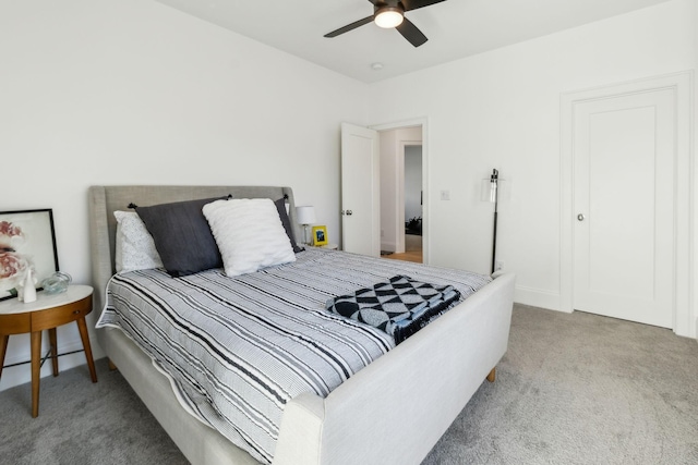 carpeted bedroom featuring ceiling fan