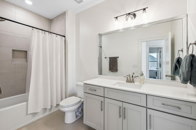 full bathroom featuring shower / tub combo with curtain, vanity, toilet, and tile patterned flooring