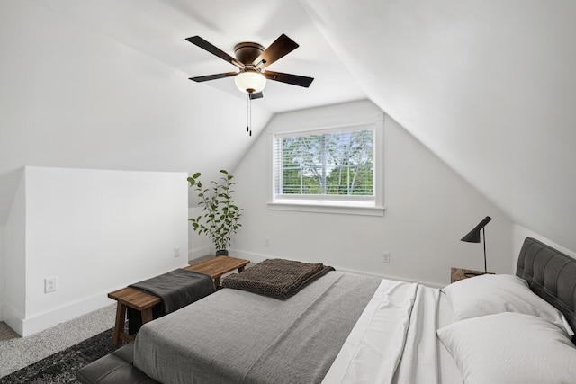 bedroom featuring vaulted ceiling, carpet flooring, and ceiling fan