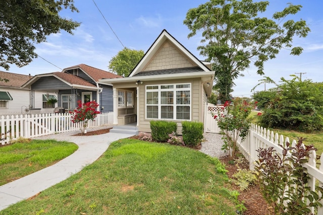 bungalow-style house with a front yard