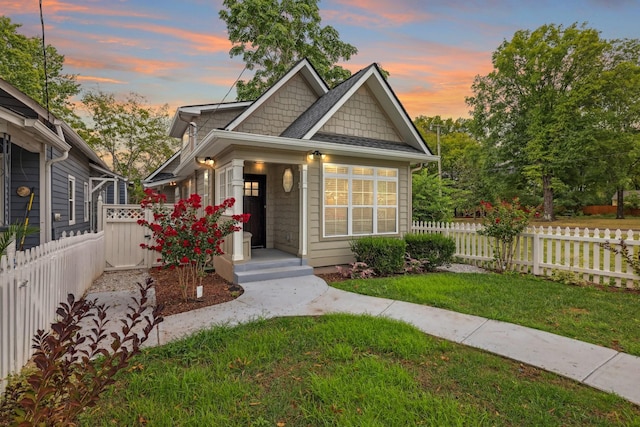 view of front of home with a yard