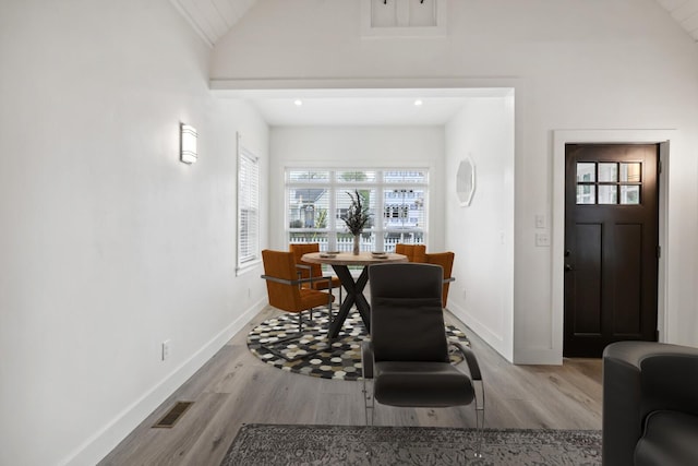 interior space with high vaulted ceiling and light hardwood / wood-style floors