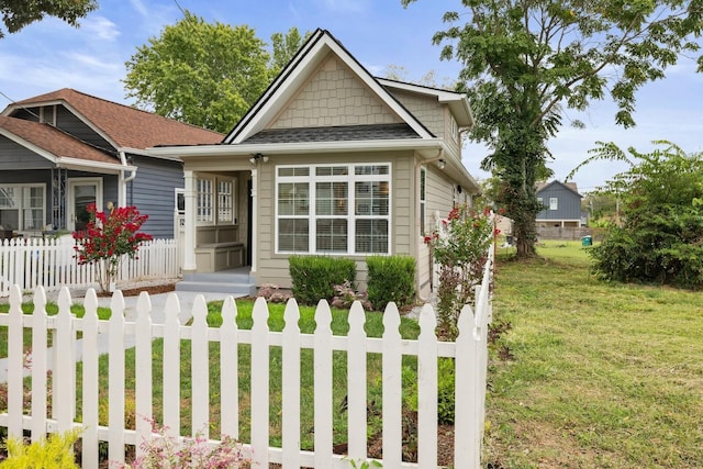 view of front of home with a front lawn