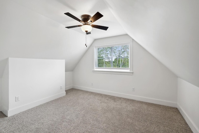 bonus room with lofted ceiling, carpet floors, and ceiling fan