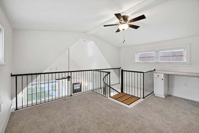 bonus room featuring ceiling fan, light colored carpet, and lofted ceiling with beams