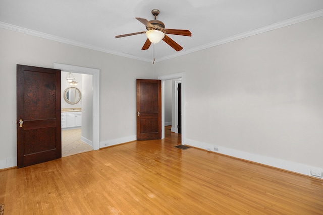 unfurnished bedroom with ceiling fan, ornamental molding, connected bathroom, and light hardwood / wood-style floors