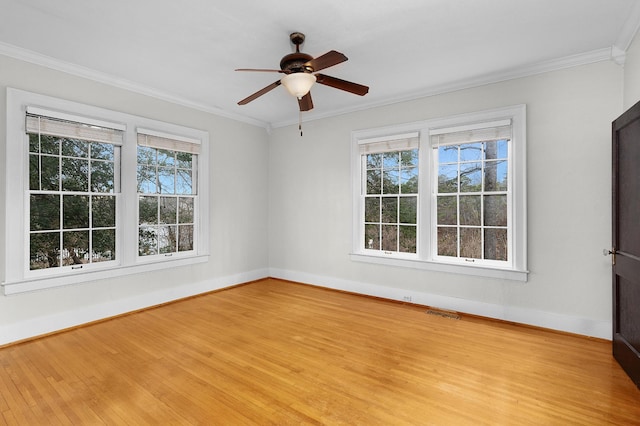 unfurnished room with crown molding, ceiling fan, and light hardwood / wood-style flooring