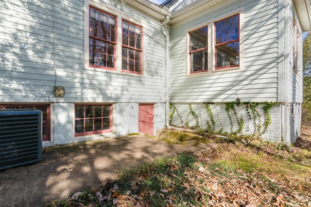 exterior space featuring cooling unit and a patio area