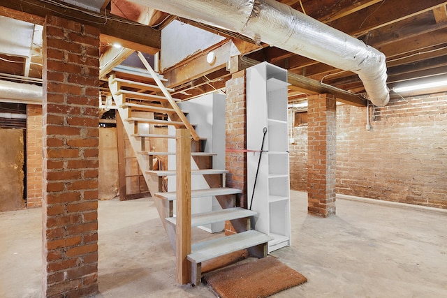 basement with brick wall