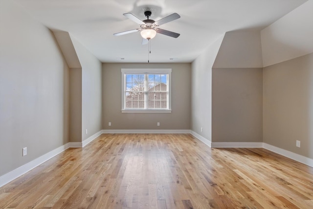 additional living space featuring light hardwood / wood-style flooring and ceiling fan